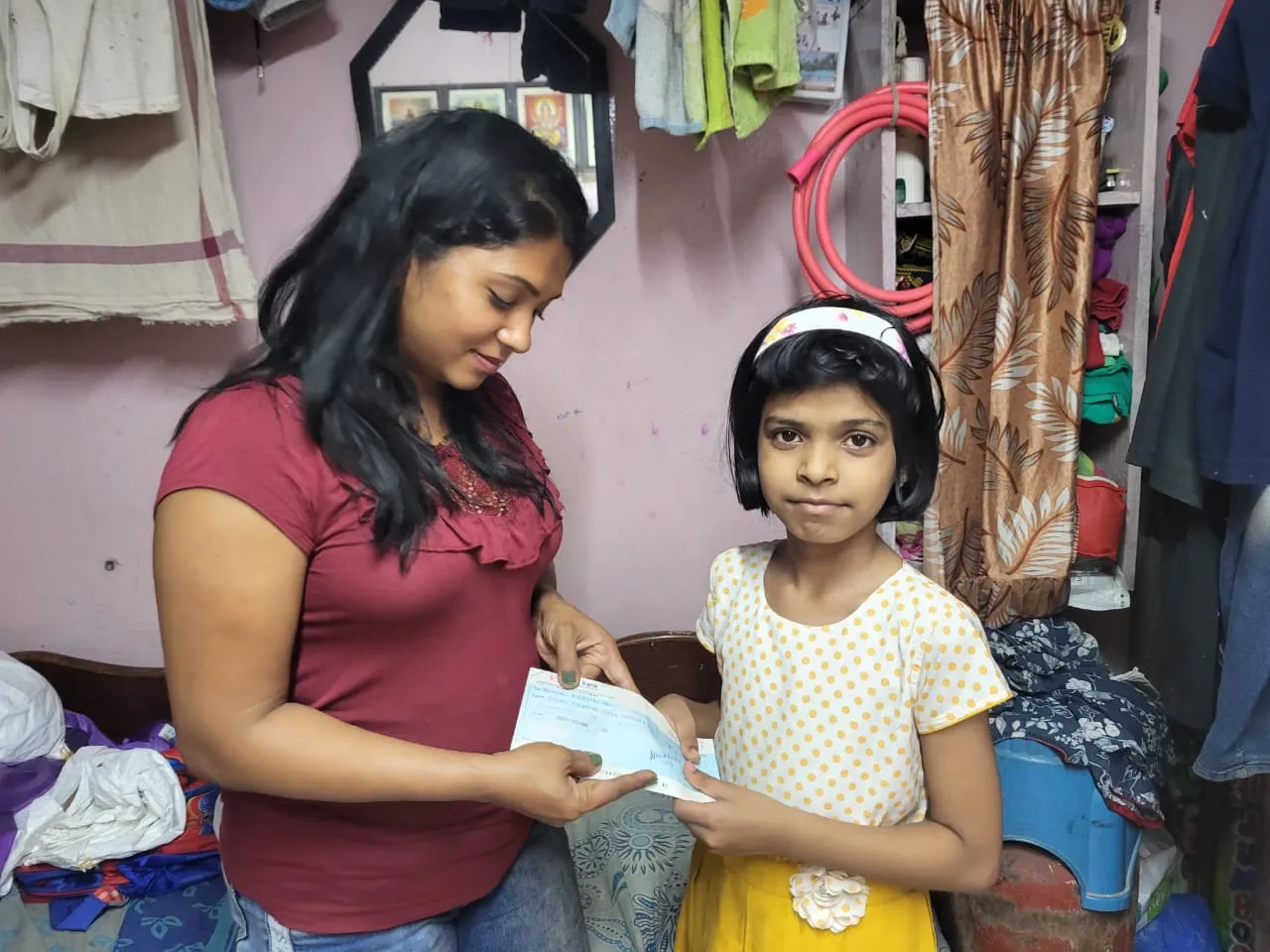 “Handing over school fee assistance to underprivileged students to support their education and help them continue their studies.”